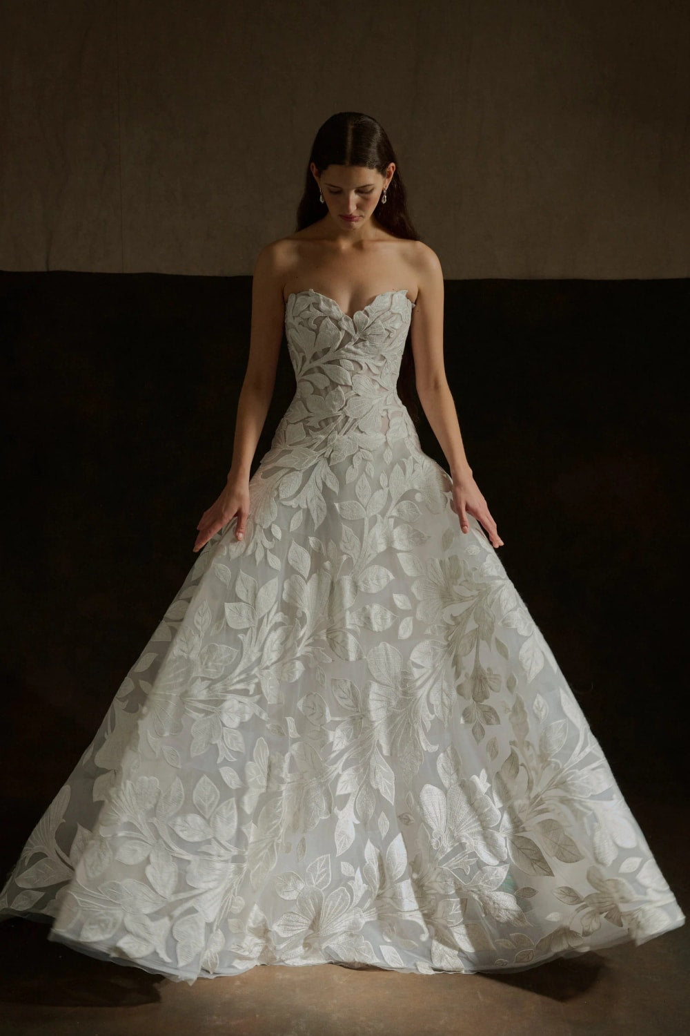 Elegant Strapless Ball Gown with Embroidered Floral Motifs by Enaura Bridal — image 1 of 4