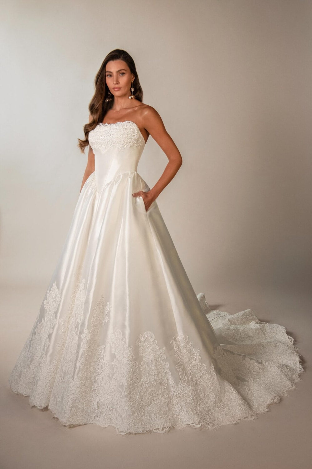 Strapless A-Line Wedding Dress with Intricate Lace Trim and Detailing by Martina Liana — image 1 of 2
