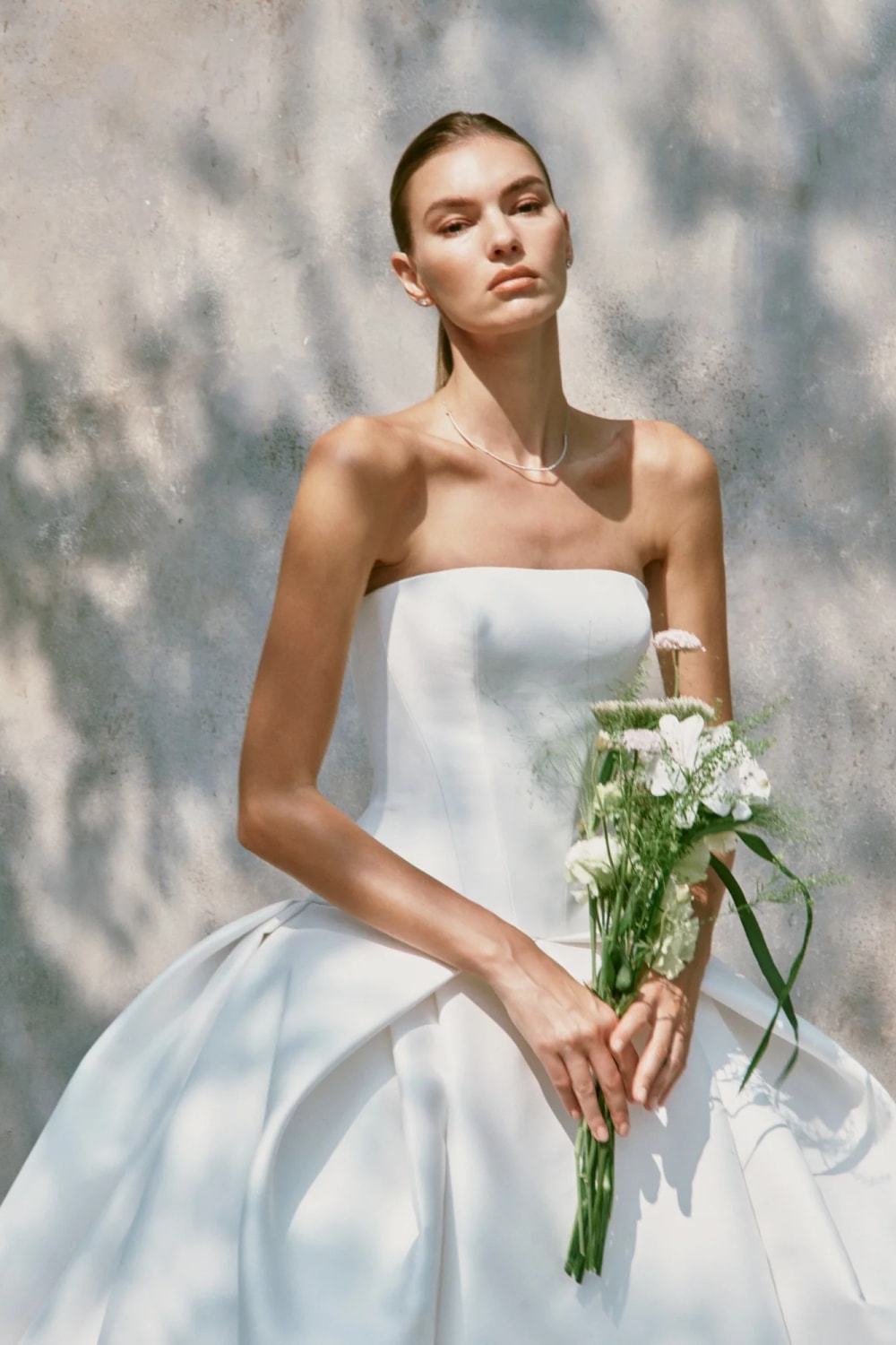 Strapless Chic and Structured Ball Gown by Nicole + Felicia — image 2 of 3