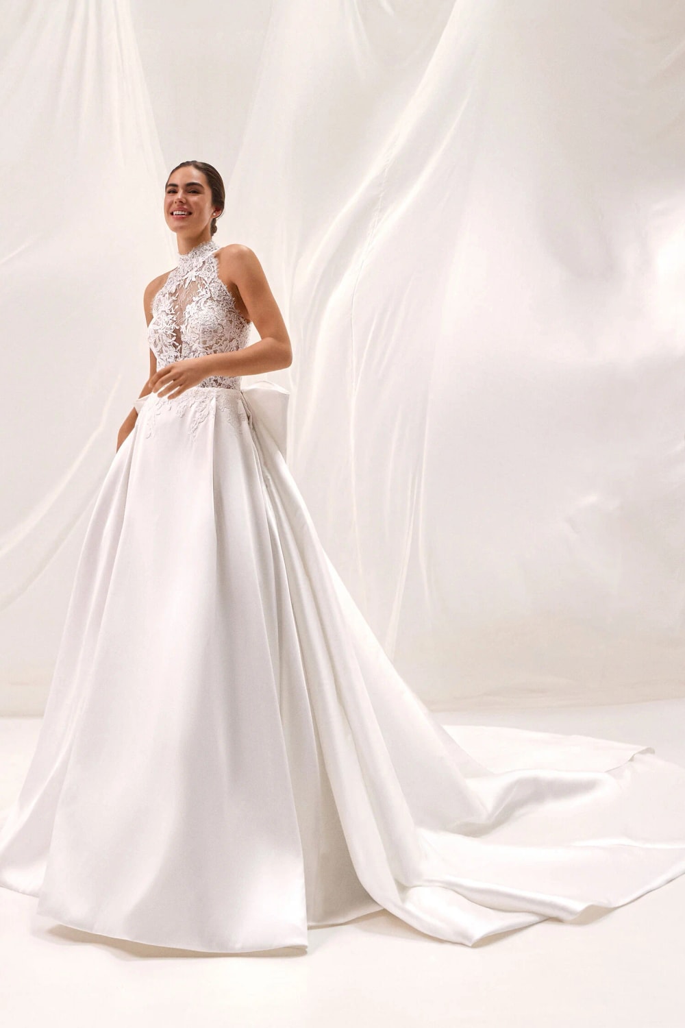 High Neck Halter Ball Gown with Lace Detailed Bodice and Detachable Bow by Pronovias — image 1 of 3