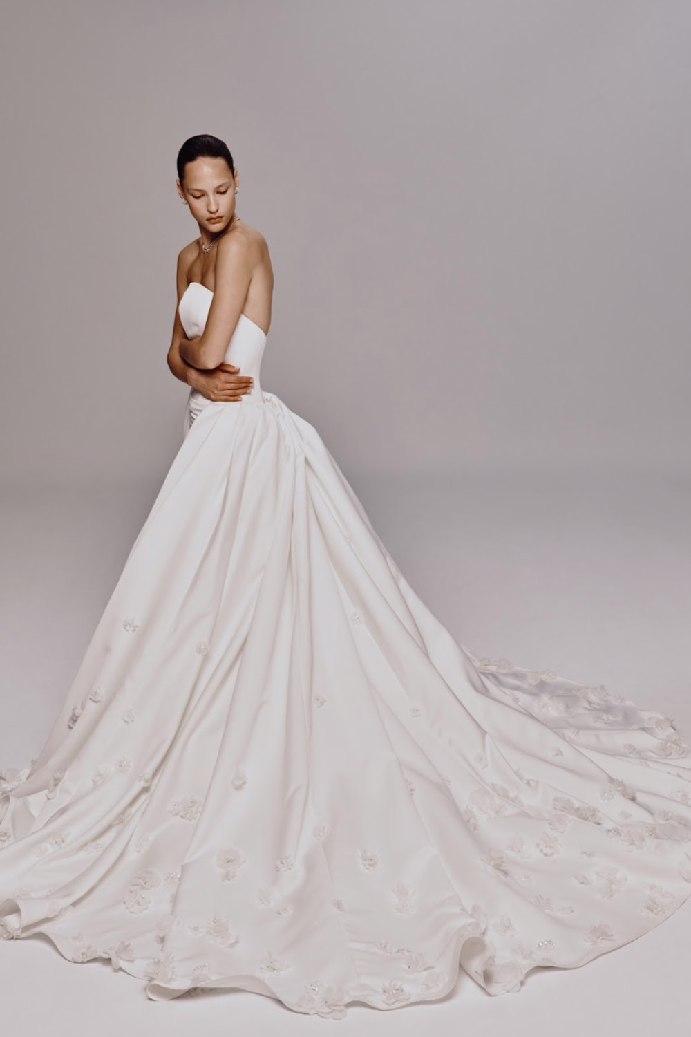 Strapless Fit-And-Flare Wedding Dress with Flower Embellishments and Detachable Train by Nicole + Felicia For Kleinfeld — image 3 of 4
