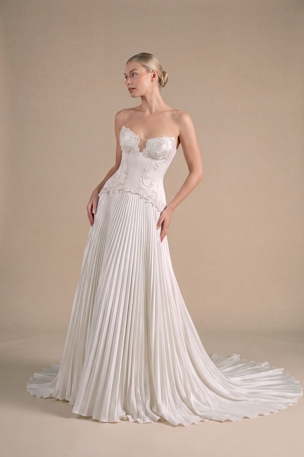 Modern Structured A-Line Wedding Dress with Pleated Skirt by Kleinfeld By Viola Chan — image 1 of 4