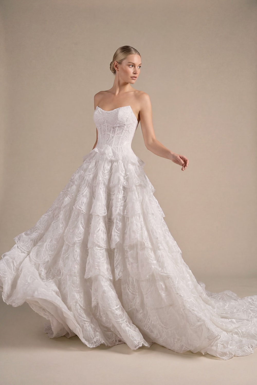 Modern Ball Gown with Beading Details and Ruffled Skirt by Kleinfeld By Viola Chan — image 2 of 3