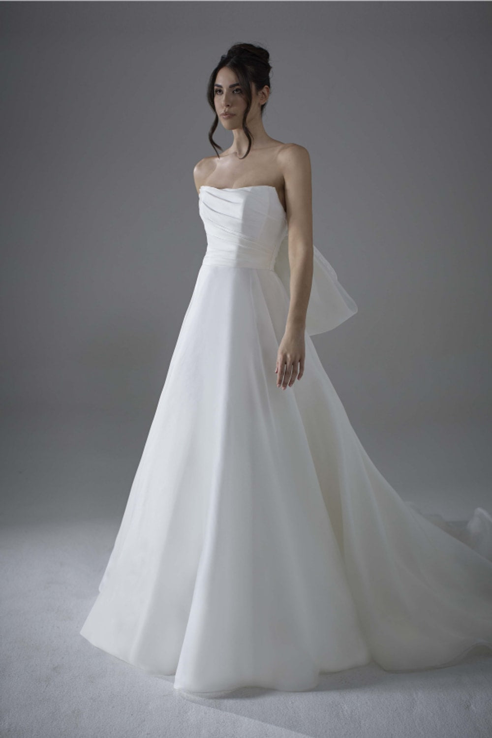 Modern A-Line Wedding Dress with Detachable Lace Topper and Bow Detail by Maison Signore — image 3 of 4