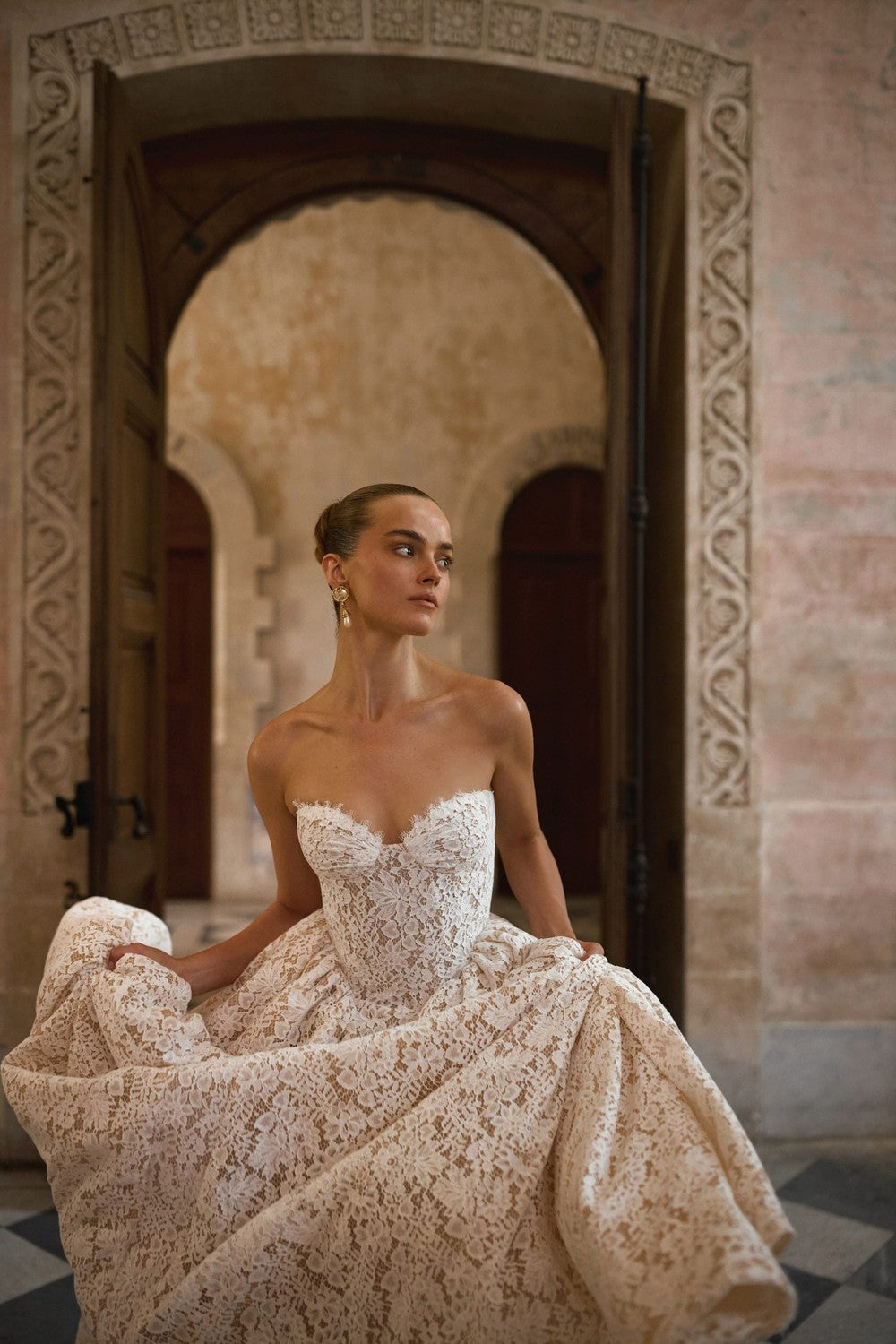 Regal And Romantic Strapless Lace A-Line Wedding Dress by Alon Livné for Kleinfeld — image 2 of 3