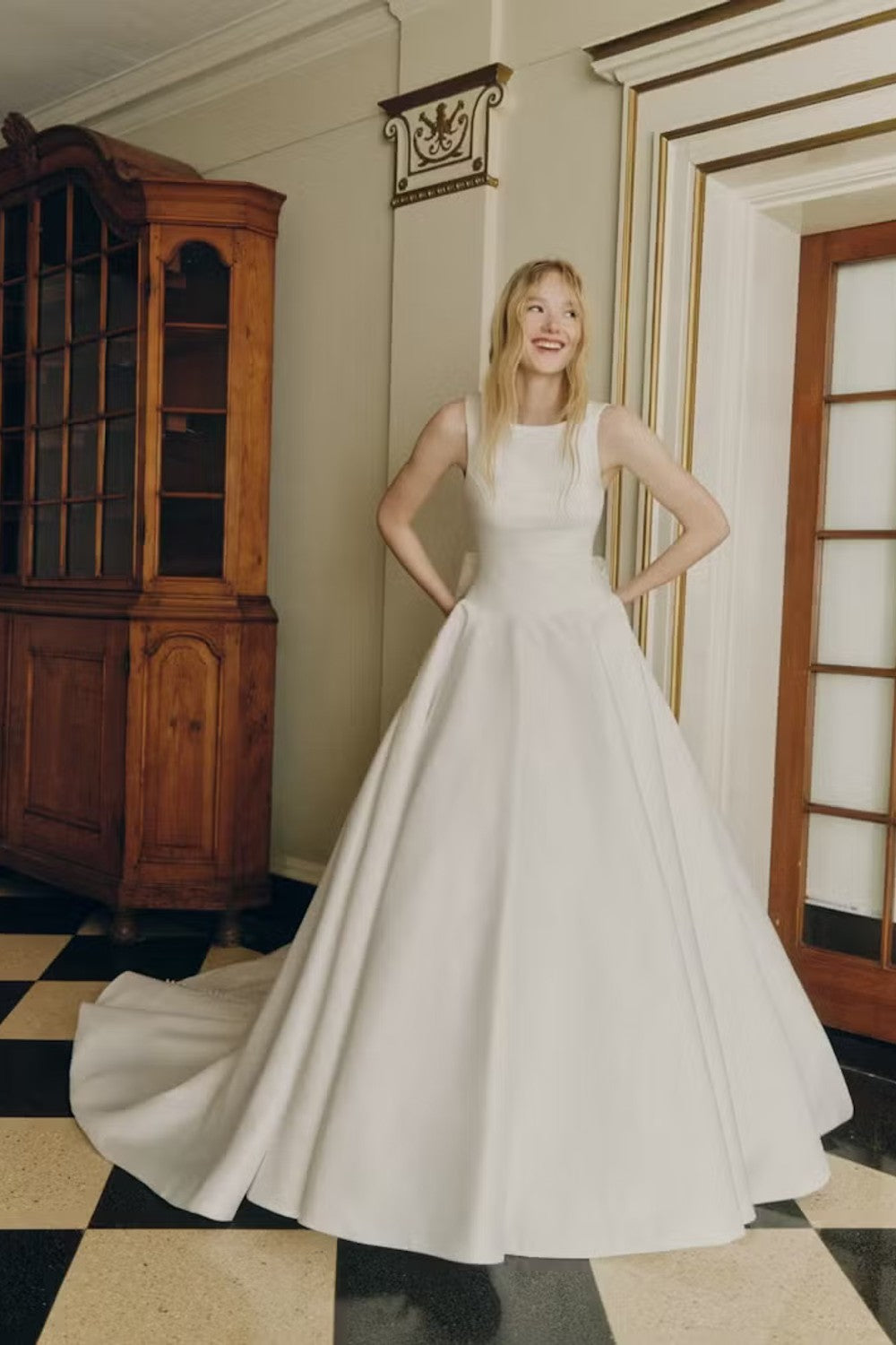 Classic And Sophisticated High-Neck Simple Ball Gown With Open Back And Bow by Alyne by Rita Vinieris — image 1 of 3