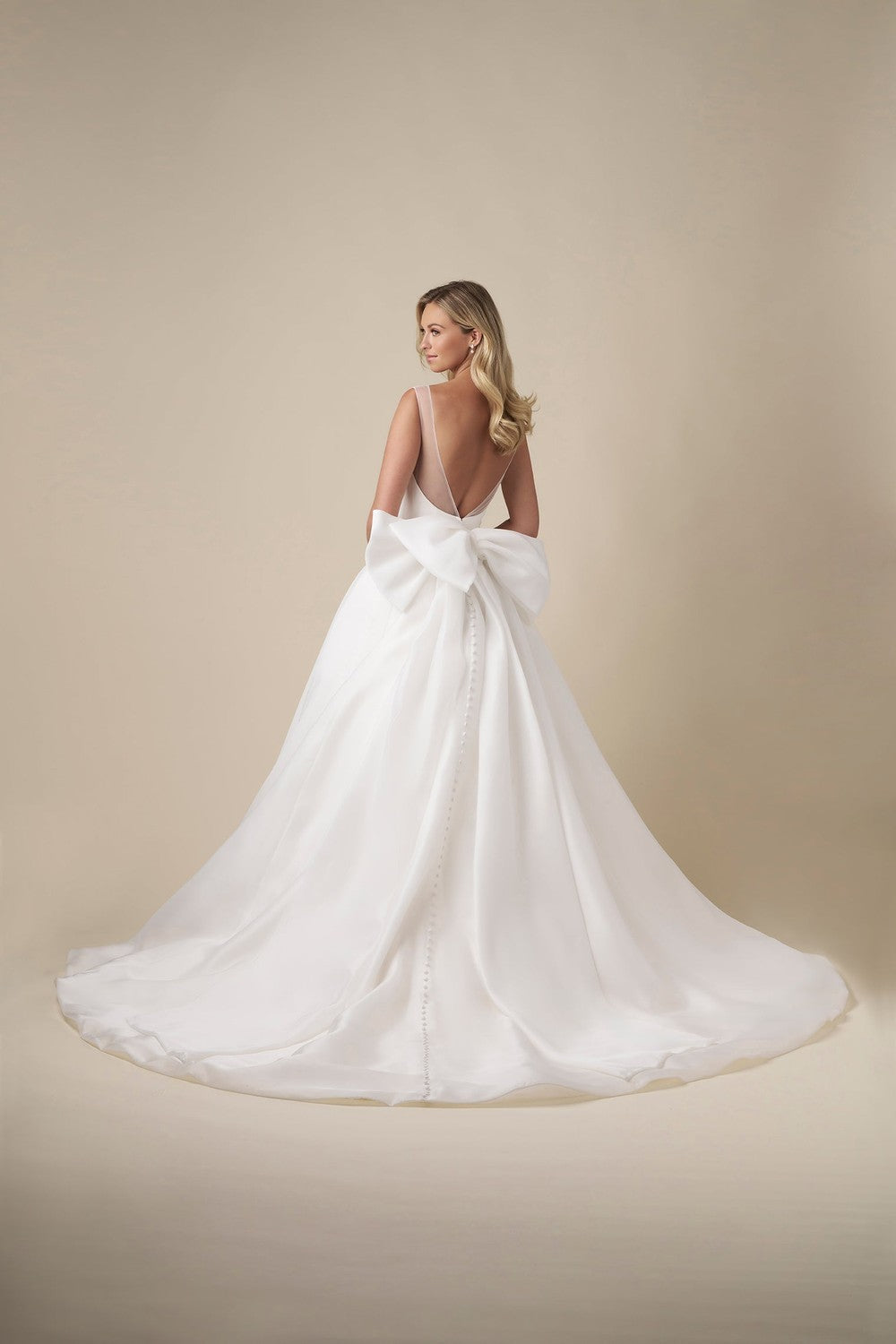 Chic And Tailored A-Line Wedding Dress With Bow And Buttons by Danielle Caprese β image 3 of 4