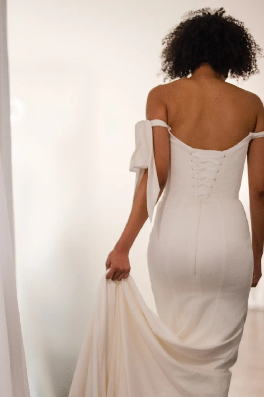 Plus-Size Minimalist Sheath Wedding Dress With Off-The-Shoulder Bows by Love by Pnina Tornai — image 2 of 2