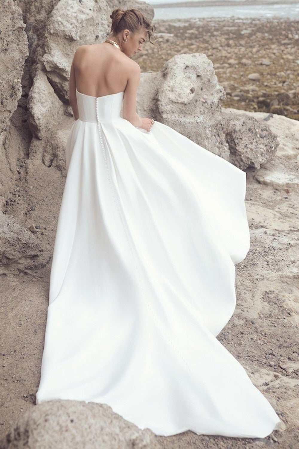 Strapless Ball Gown With Draped Bodice And Side Slit With Pockets by Maggie Sottero — image 2 of 2