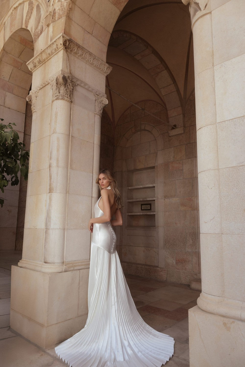 Simple Halter-Neck Drop-Waist A-Line Wedding Dress With Accordion Skirt by Pnina Tornai — image 2 of 2