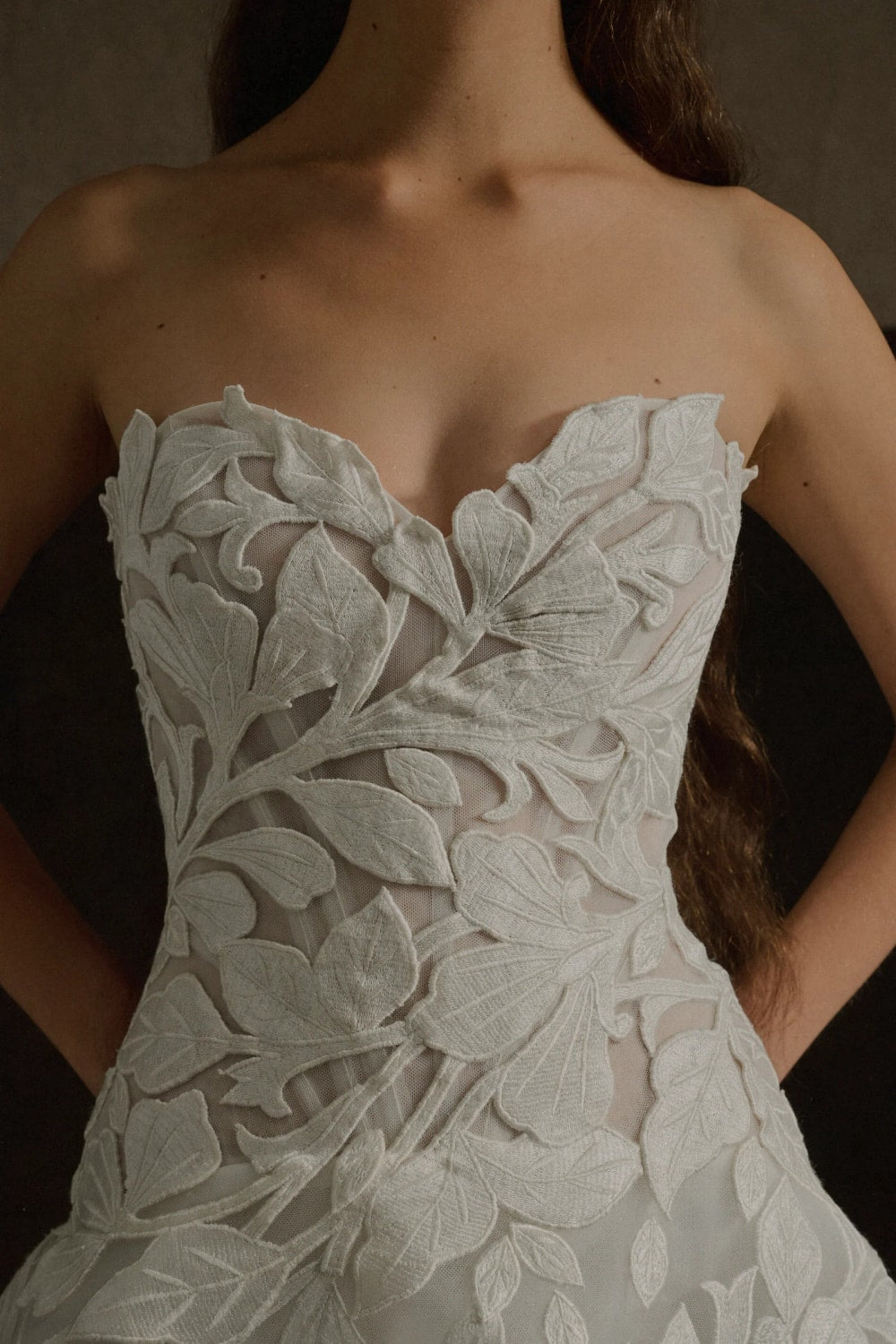 Elegant Strapless Ball Gown with Embroidered Floral Motifs by Enaura Bridal — image 2 of 4