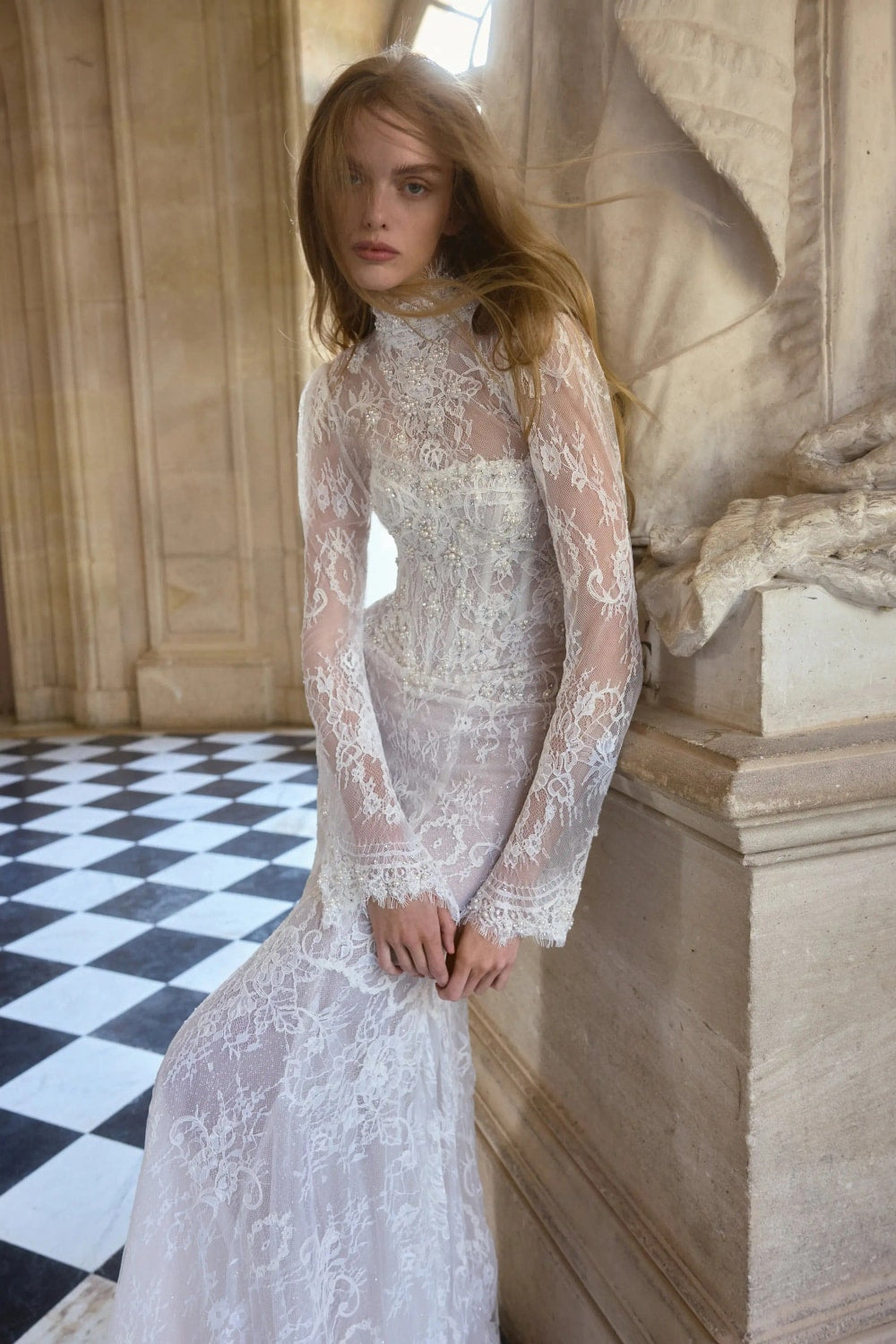 Intricately Detailed Lace Fit-And-Flare Wedding Dress by Netta BenShabu Elite Couture — image 1 of 3