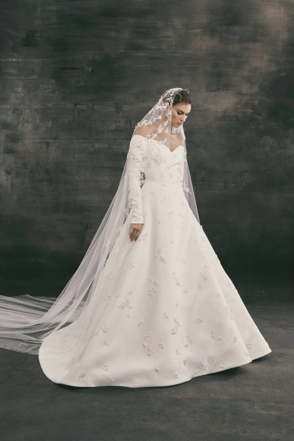 Long-Sleeve Off-The-Shoulder A-Line Wedding Dress with Embellishments by Nicole + Felicia — image 1 of 3