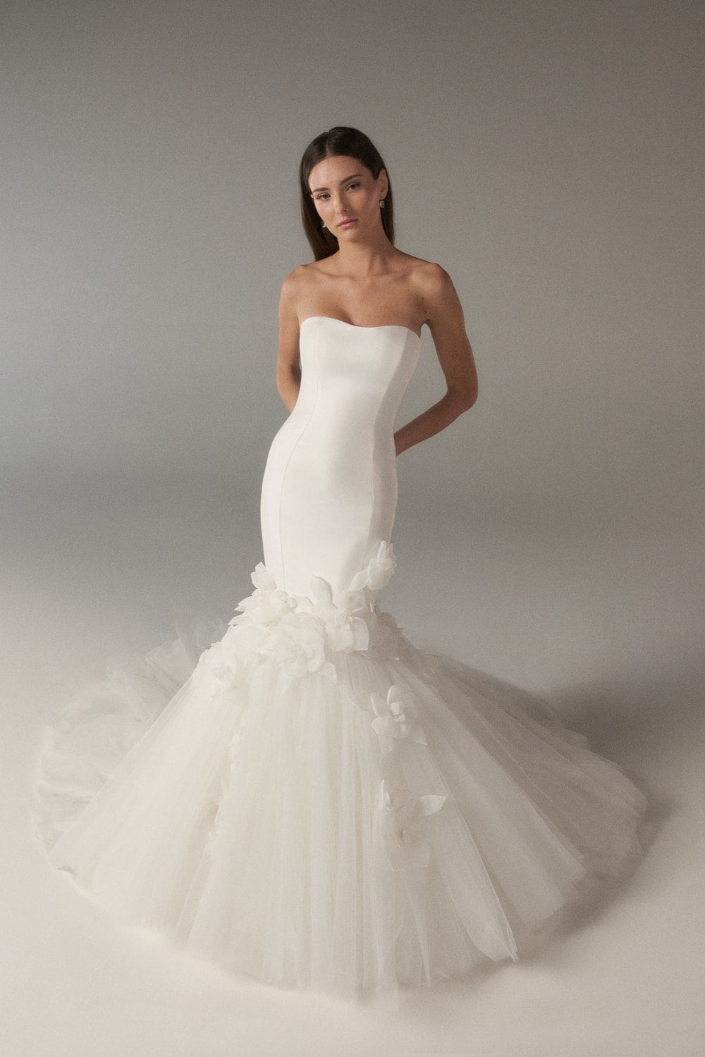 Elegant and Clean Mermaid Wedding Dress with Floral Skirt Details by Poeza — image 1 of 2