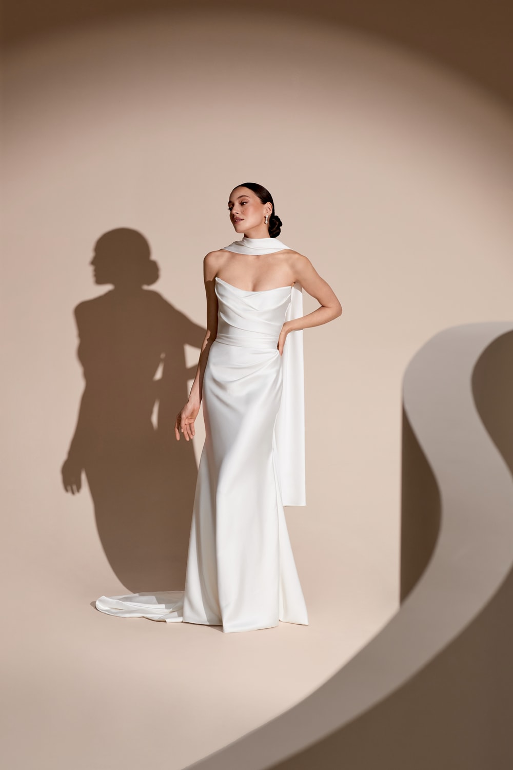 Elegant and Chic Fit-And-Flare Wedding Dress with a Cat-Eye Bodice by Savannah Miller — image 1 of 2