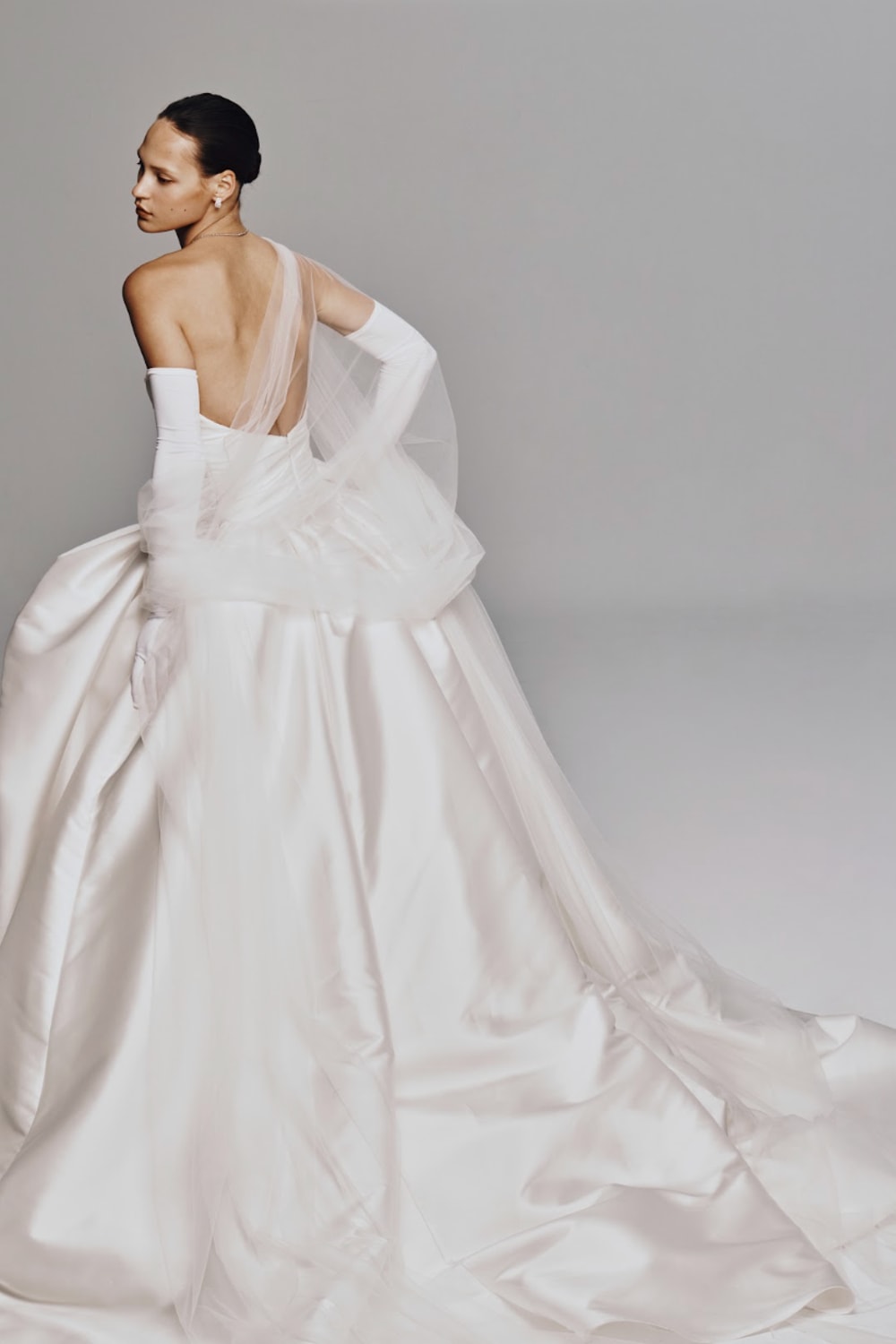 Modern and Sculptural High-Low Ball Gown by Nicole + Felicia For Kleinfeld — image 2 of 4