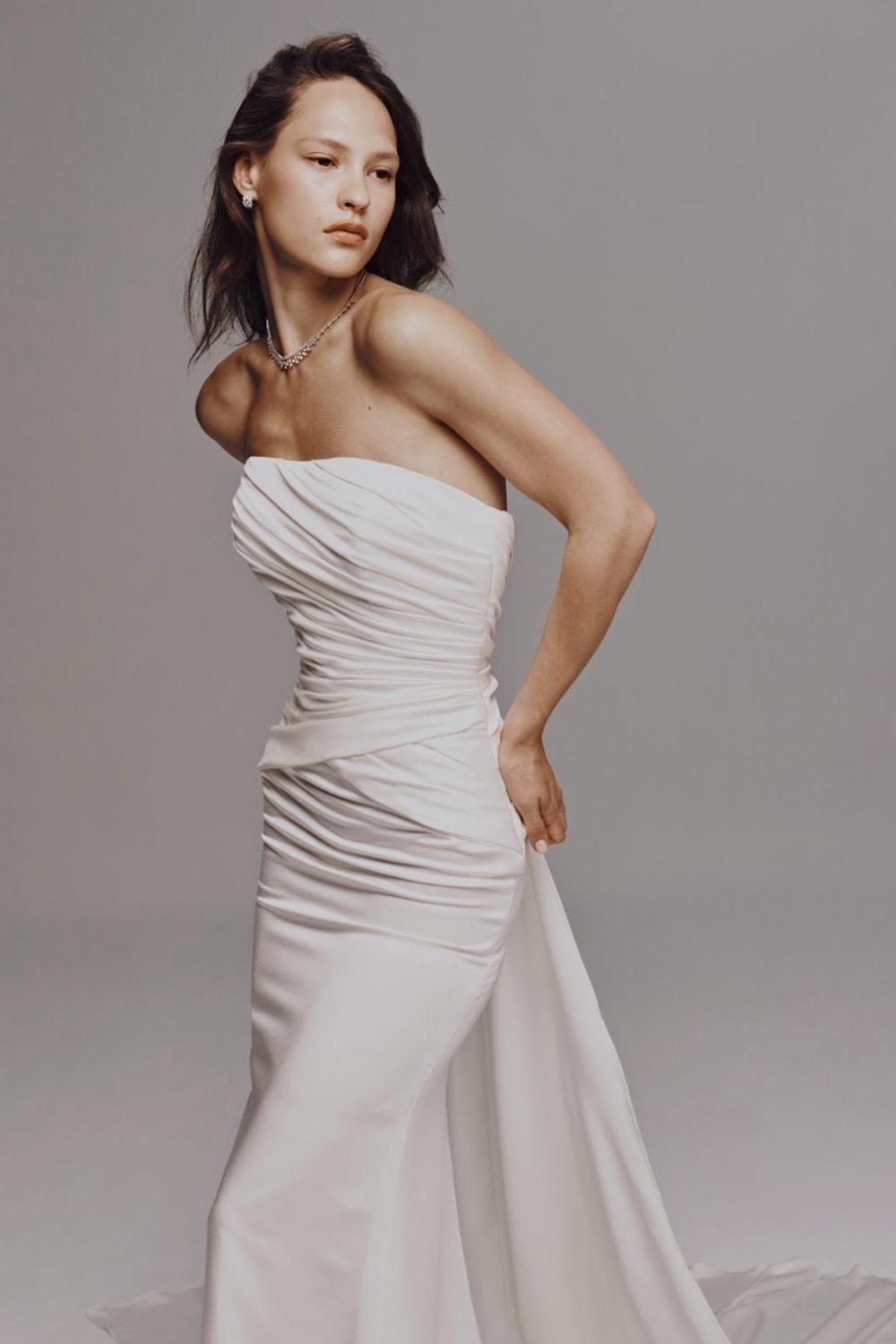 Strapless Sheath Wedding Dress with Ruching and Detachable Train by Nicole + Felicia For Kleinfeld — image 2 of 3