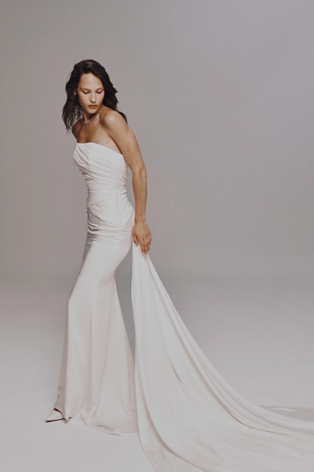 Strapless Sheath Wedding Dress with Ruching and Detachable Train by Nicole + Felicia For Kleinfeld — image 3 of 3