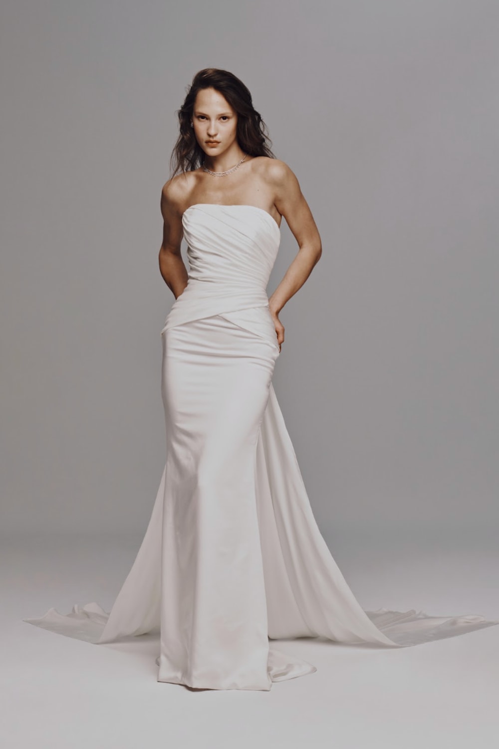 Strapless Sheath Wedding Dress with Ruching and Detachable Train by Nicole + Felicia For Kleinfeld — image 1 of 3