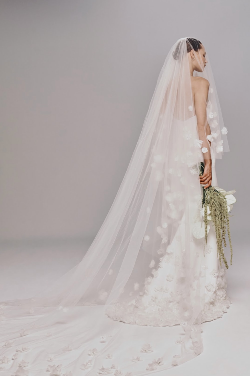 Strapless Fit-And-Flare Wedding Dress with Flower Embellishments and Detachable Train by Nicole + Felicia For Kleinfeld — image 4 of 4
