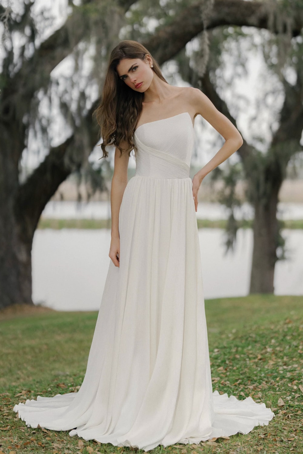 Modern A-Line Wedding Dress with Asymmetrical Neckline by Anne Barge — image 1 of 3