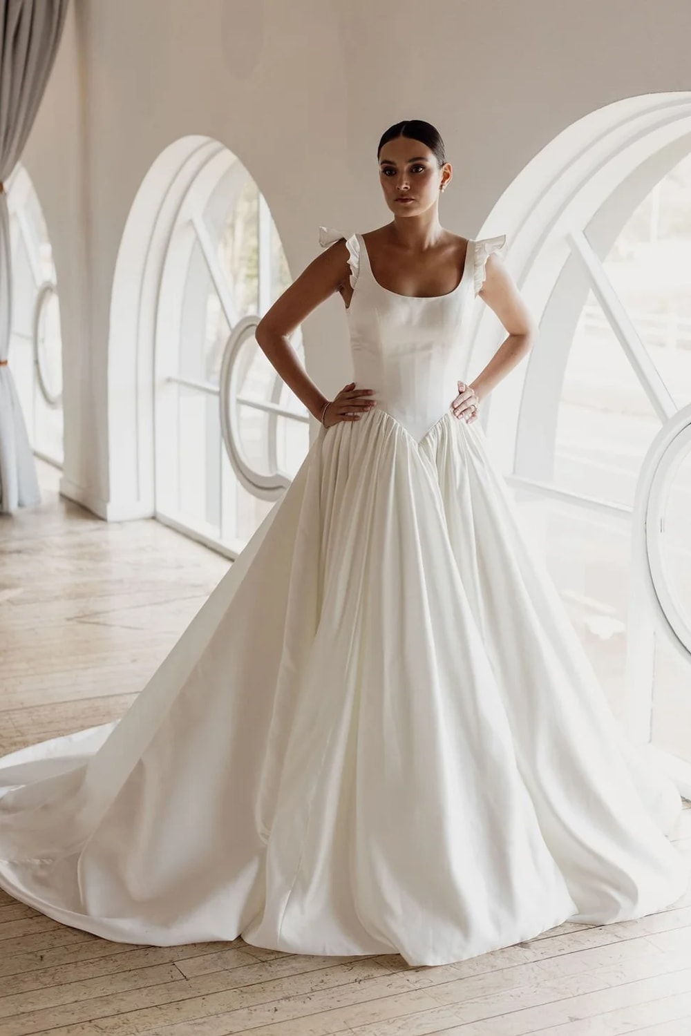 Delicate and Feminine A-Line Wedding Dress with Ruffle Straps and Basque Waist by Trish Peng — image 1 of 5