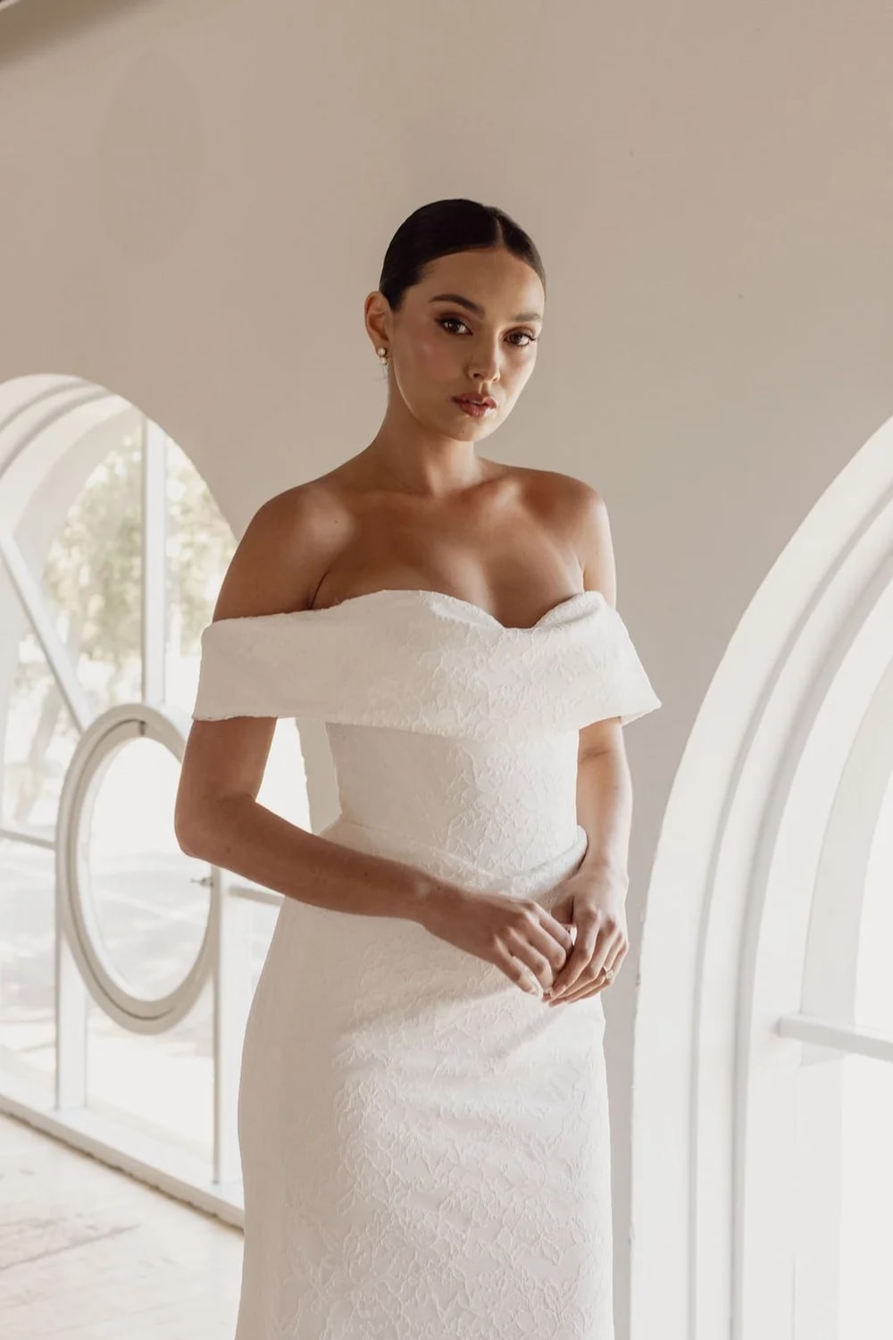 Modern and Sculpted Sheath Wedding Dress with Floral Lace by Trish Peng — image 2 of 5