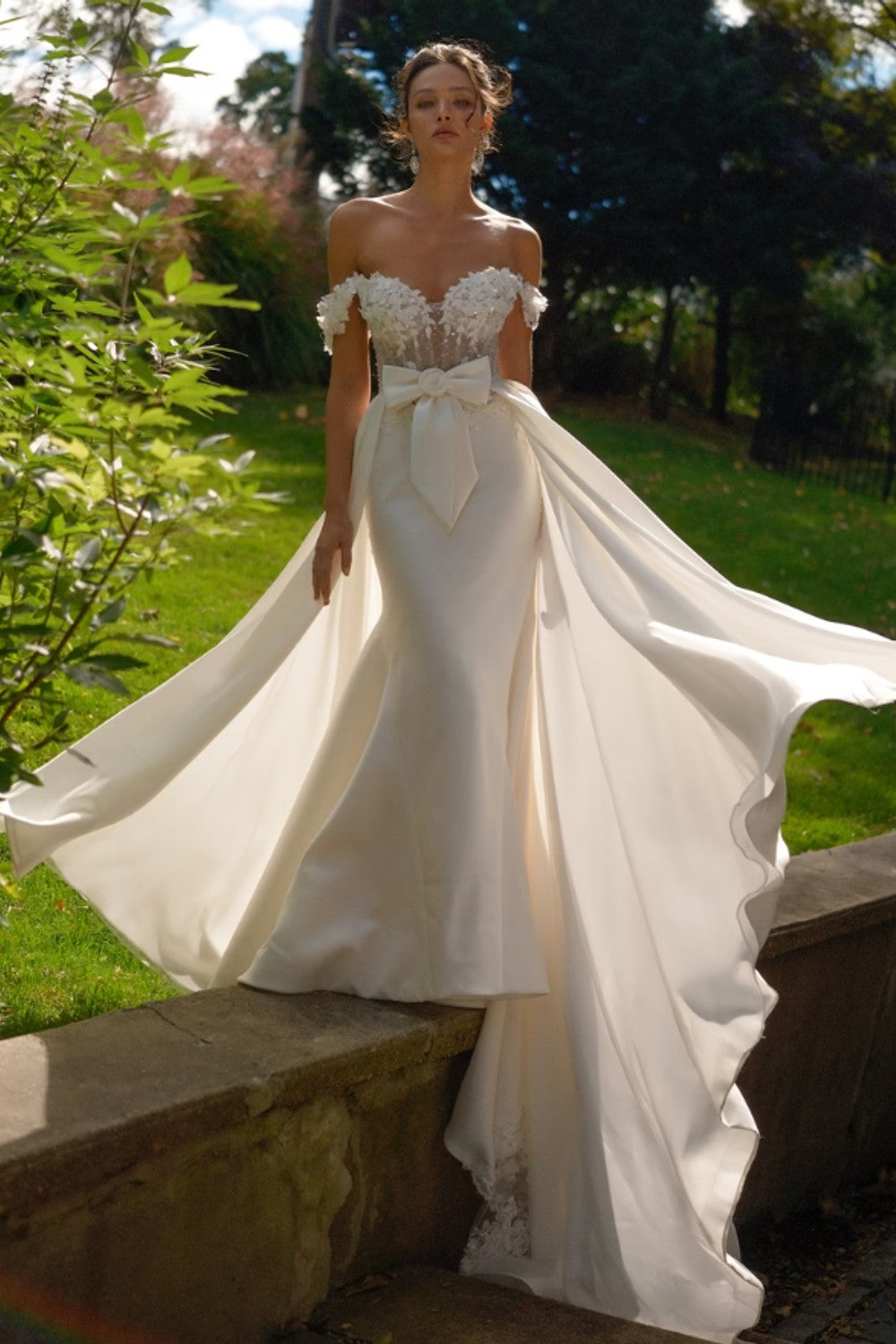 Off-The-Shoulder Fit-and-Flare Wedding Dress With Detachable Overskirt by Eve of Milady — image 2 of 3