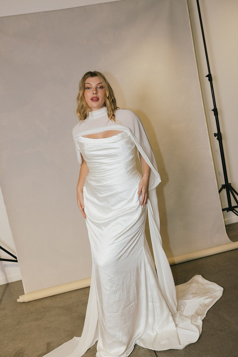 Plus-Size Silk Sheath Wedding Dress With Detachable Cape And Neck Scarf | Kleinfeld Bridal Plus-Size Silk Sheath Wedding Dress With Detachable Cape And Neck Scarf | Kleinfeld Bridal