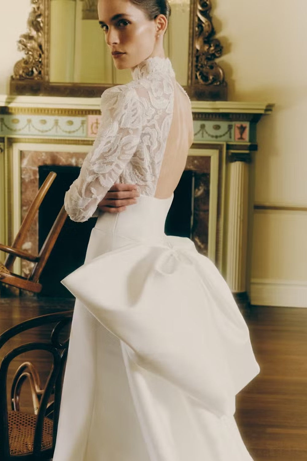 Sophisticated High-Neck Long Sleeve Fit-And-Flare Wedding Dress With Bow by Rivini — image 2 of 3