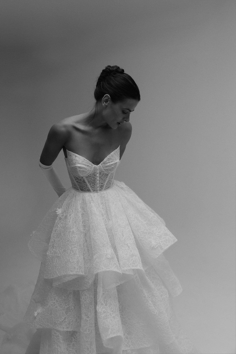 Feminine And Whimsical Lace Tiered Ball Gown by Tal Kedem Bridal Couture — image 1 of 4