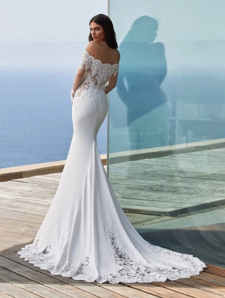 Long-sleeved mermaid wedding dress in crepe with wraparound neckline