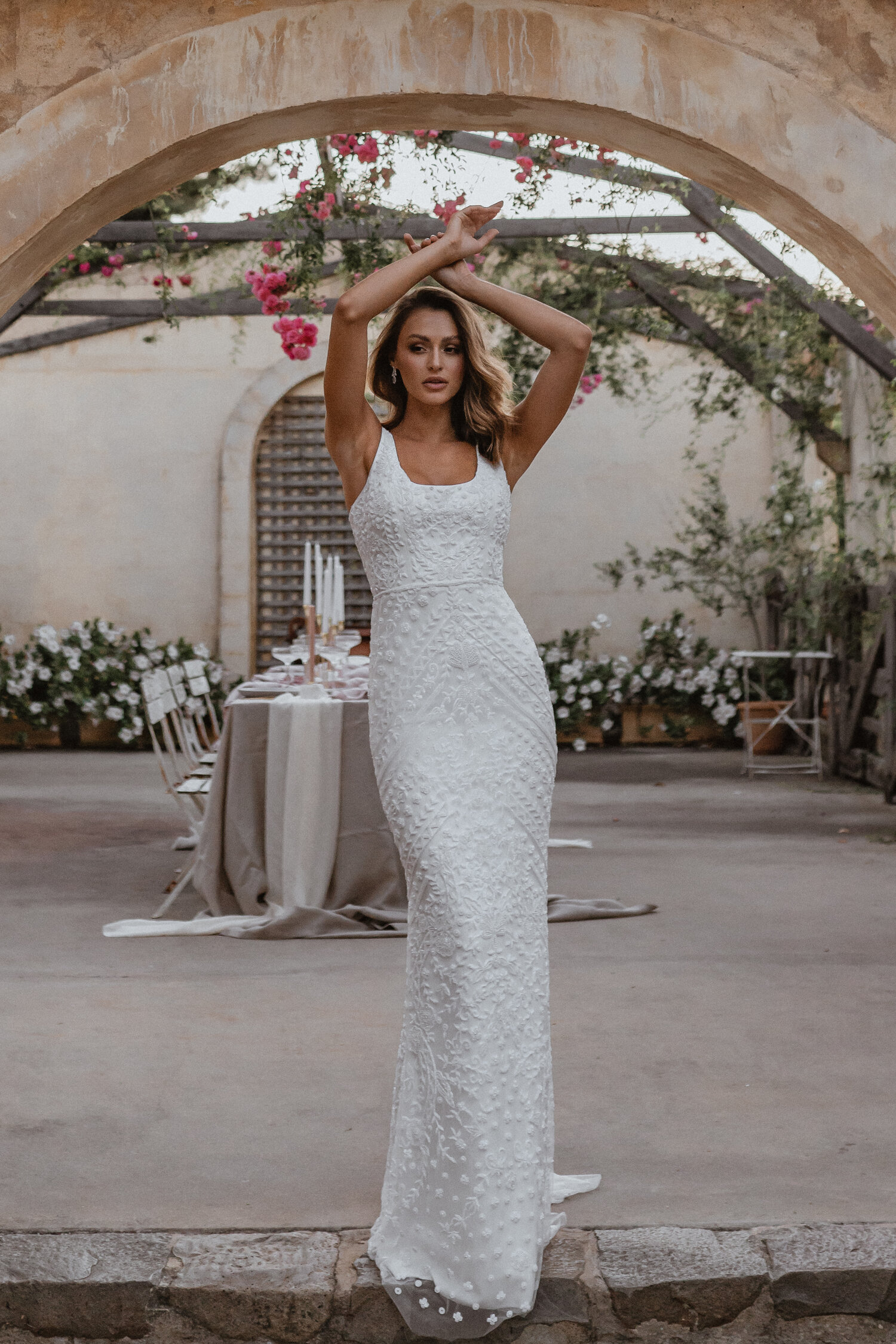 https://www.kleinfeldbridal.com/wp-content/uploads/2021/04/anna-campbell-sleeveless-square-neckline-fitted-sheath-wedding-dress-with-beading-throughout-and-train-34358770.jpg