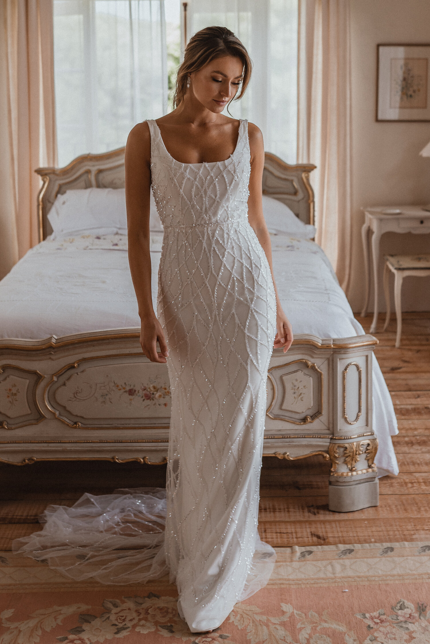 https://www.kleinfeldbridal.com/wp-content/uploads/2021/04/anna-campbell-sleeveless-square-neckline-sheath-wedding-dress-with-beading-throughout-34358762.jpg