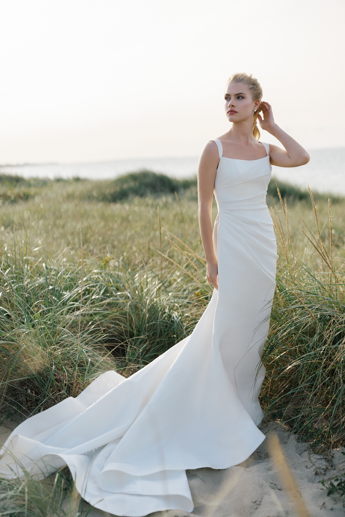 Sophisticated Fit-and-Flare Wedding Dress With Detachable Overskirt by Anne Barge - Image 1