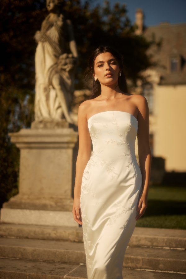 Embroidered Satin Sheath Wedding Dress With Overskirt by Enaura Bridal - Image 1