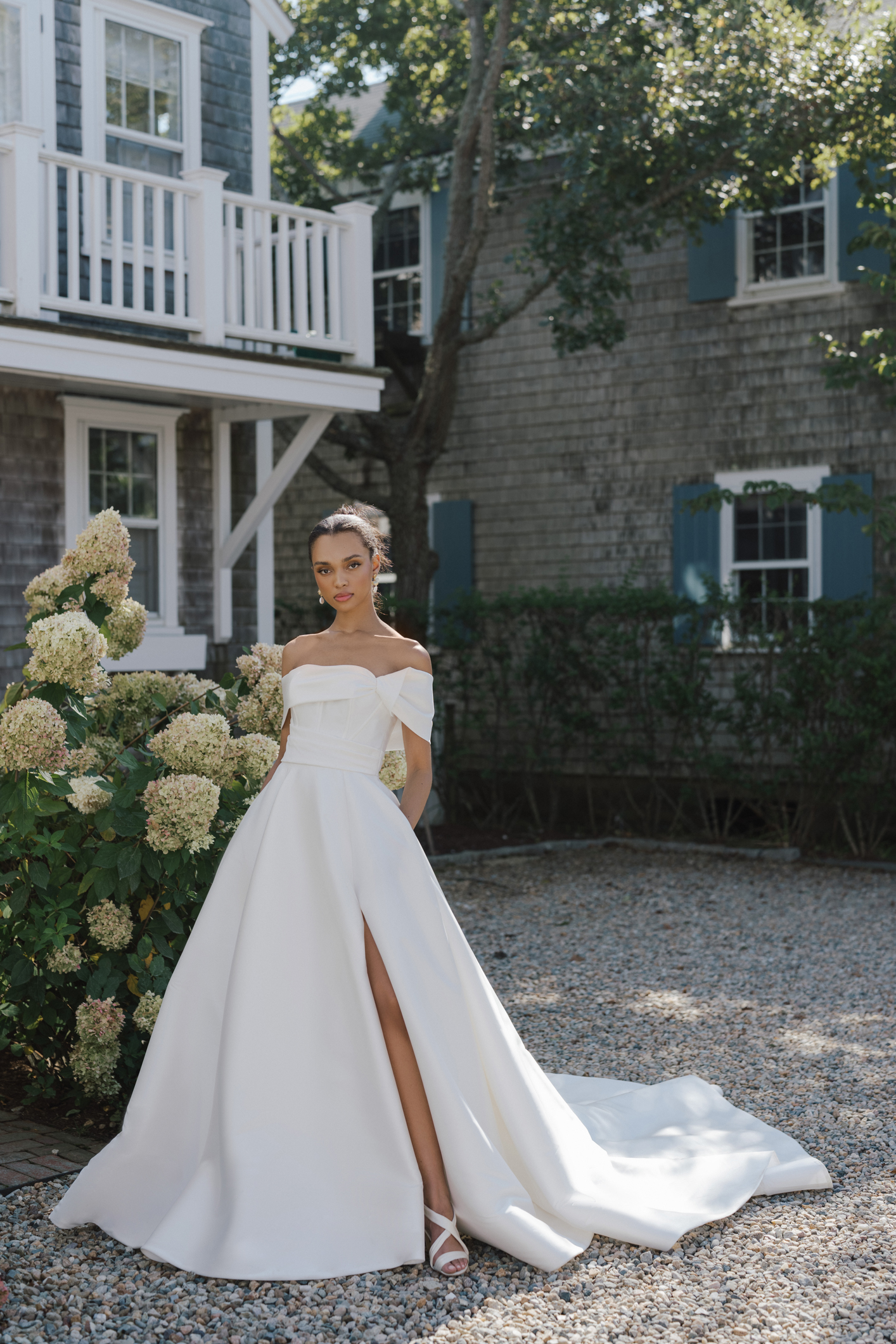 Simple And Modern Off-the-Shoulder A-Line Gown With Slit by Anne Barge - Image 1