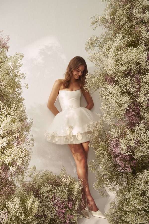 Chic And Feminine Bridal Mini Dress With Tulle And Floral Hem by Nicole + Felicia - Image 1