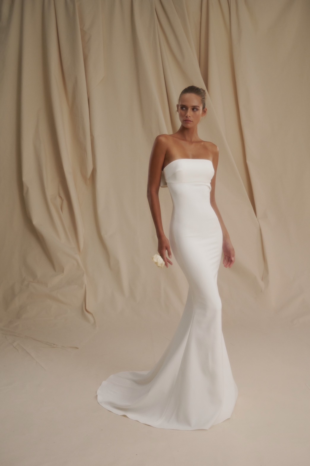 Sleek And Simple Fit-and-Flare Wedding Dress With Open Back And Bow by Senstudio - Image 1