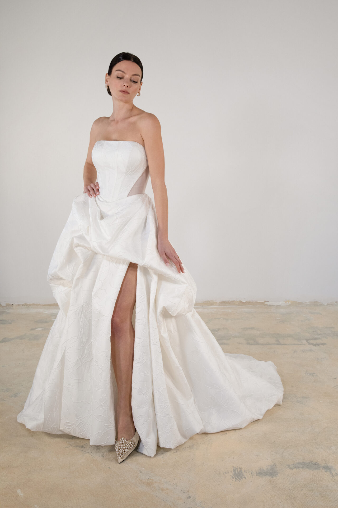 Architectural A-Line Wedding Dress With Slit And Buttons by Martina Liana Luxe - Image 1