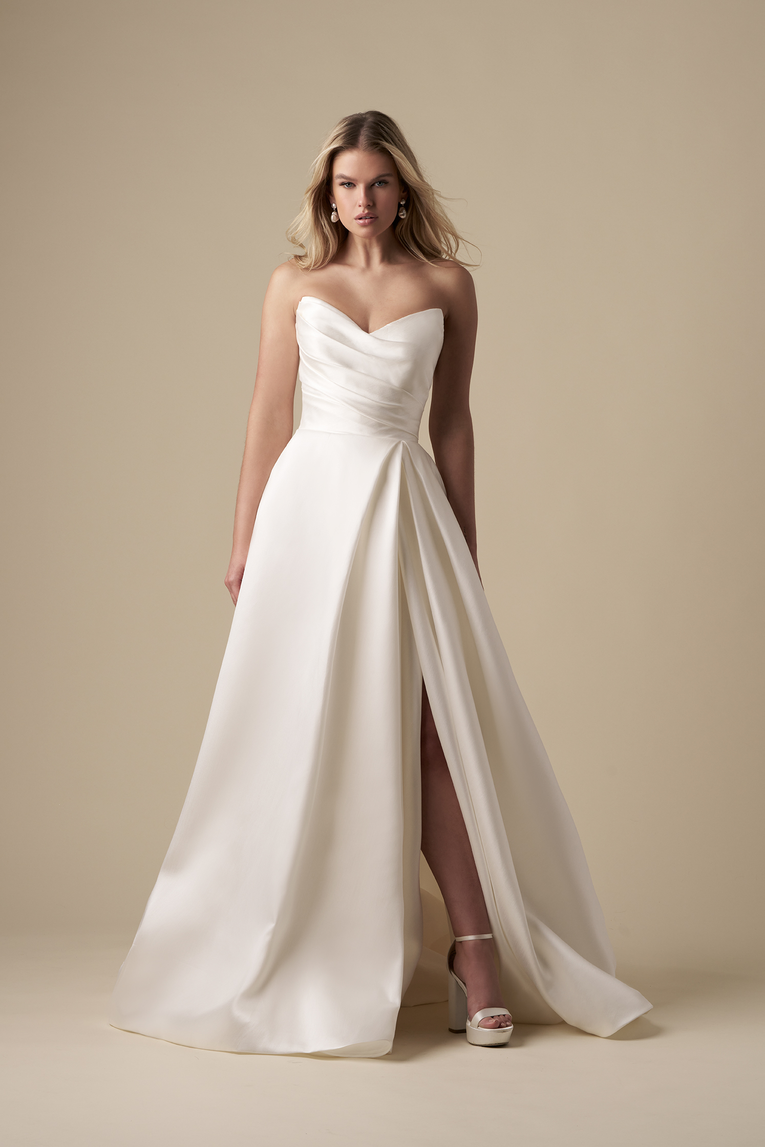 Chic And Timeless Strapless A-Line Wedding Dress With Slit by The Kleinfeld Collection - Image 1