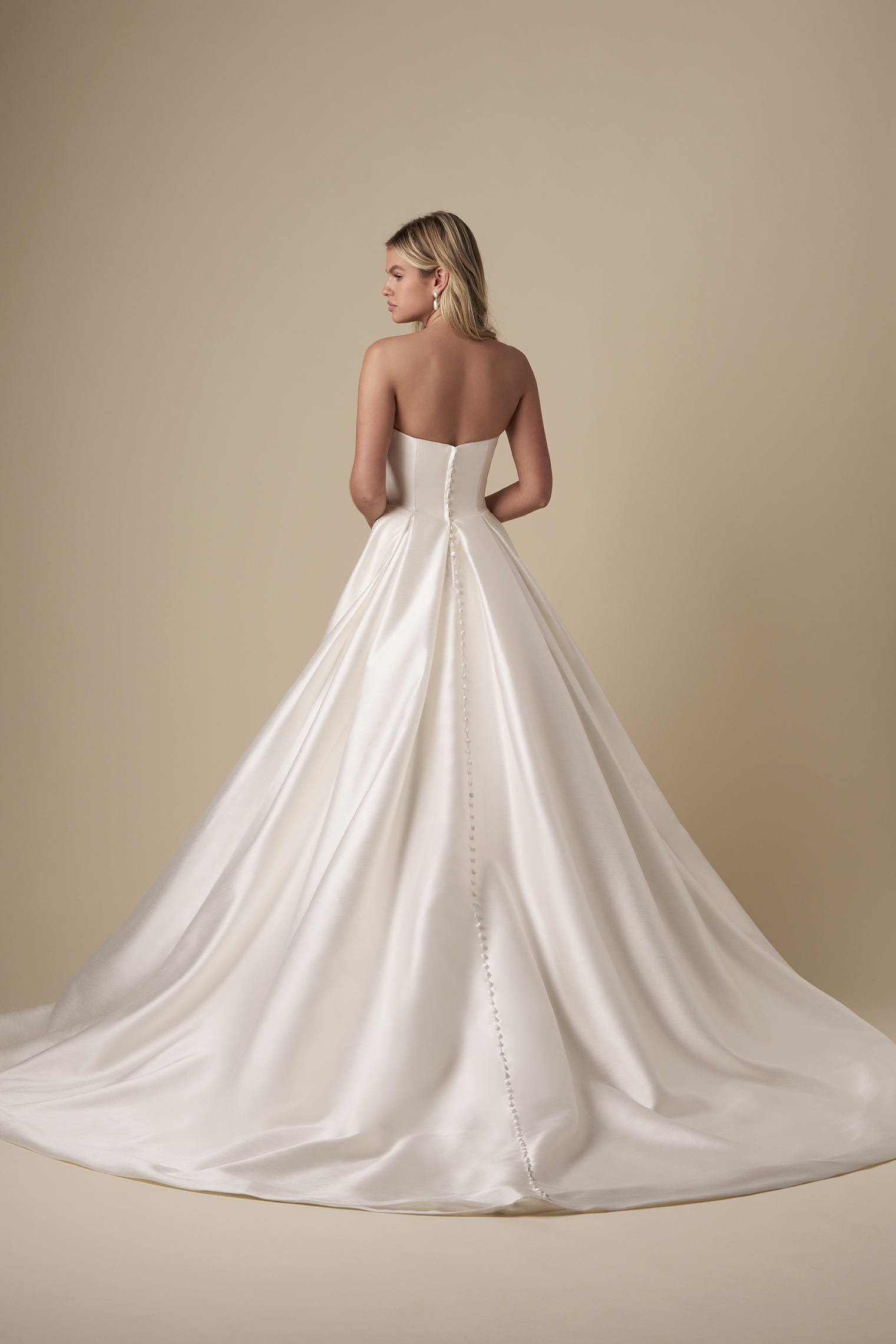 Chic And Timeless Strapless A-Line Wedding Dress With Slit by The Kleinfeld Collection - Image 3