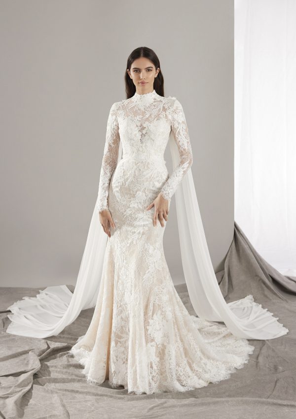 Dramatic Long Sleeve Lace Fit-and-Flare Wedding Dress With Cape by Pronovias - Image 1