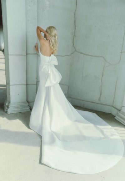 Chic and Contemporary Fit-and-Flare Wedding Dress With Abstract Bow by Rivini - Image 3