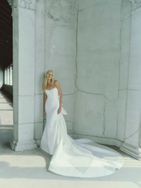 Chic and Contemporary Fit-and-Flare Wedding Dress With Abstract Bow by Rivini - Image 1